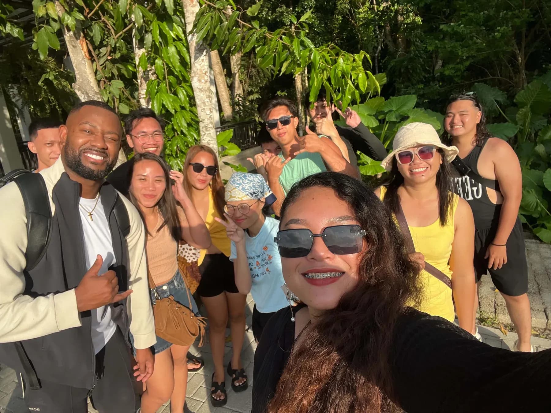 The MyThorneAI team smiling together in a tropical garden